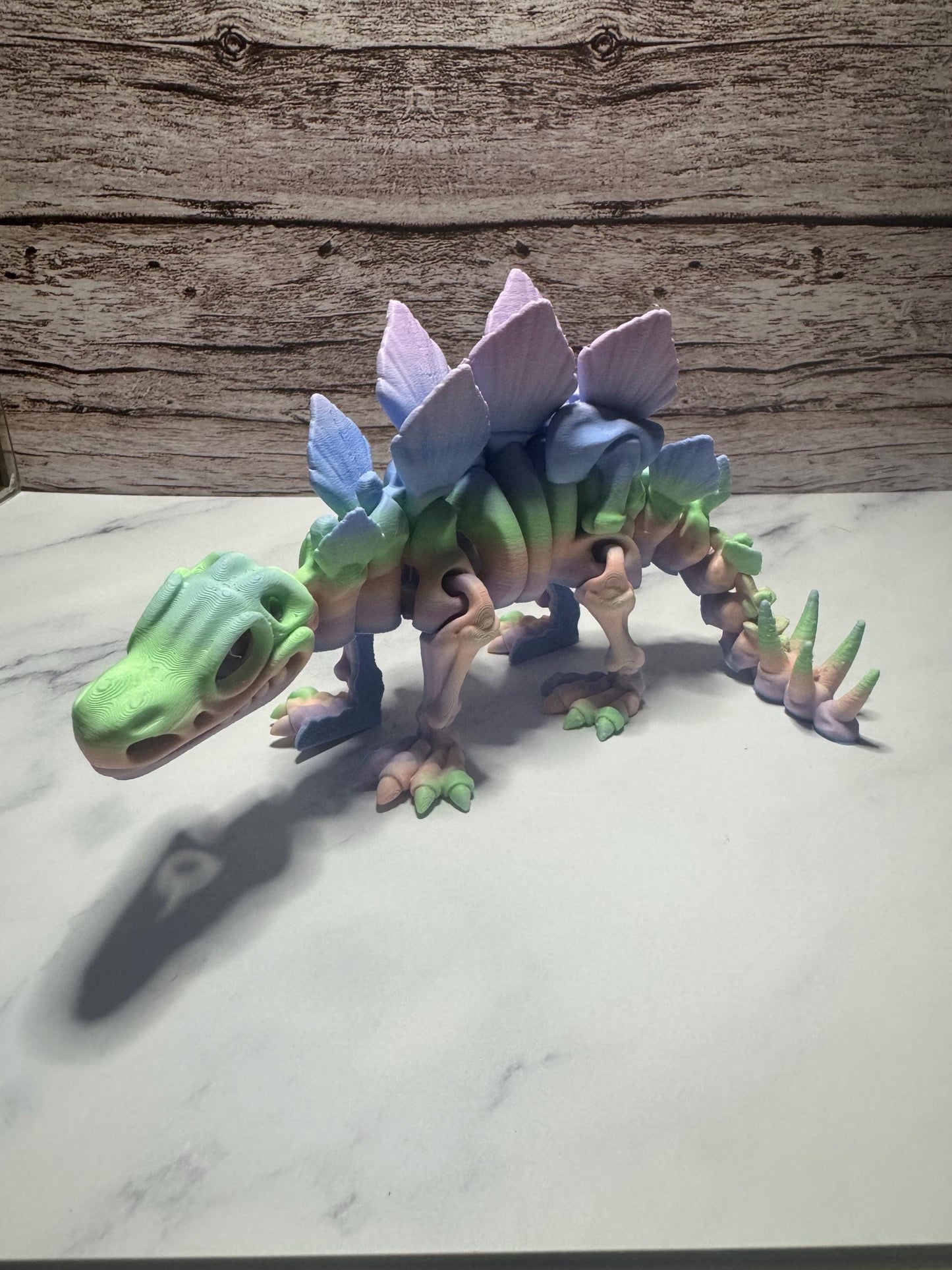 Articulated 3D Printed Stegosaurus Skeleton: Rainbow Flexi Dinosaur Toy for Prehistoric Enthusiasts