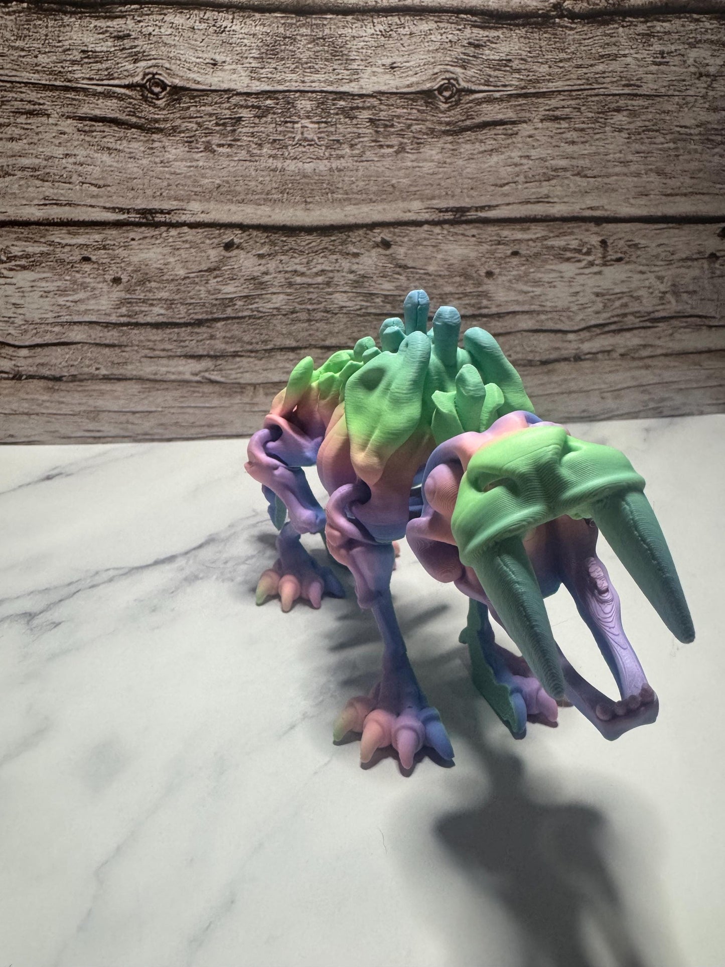Articulated 3D Printed Saber-Toothed Tiger Skeleton: Rainbow Flexi Fidget Toy for Prehistoric Enthusiasts