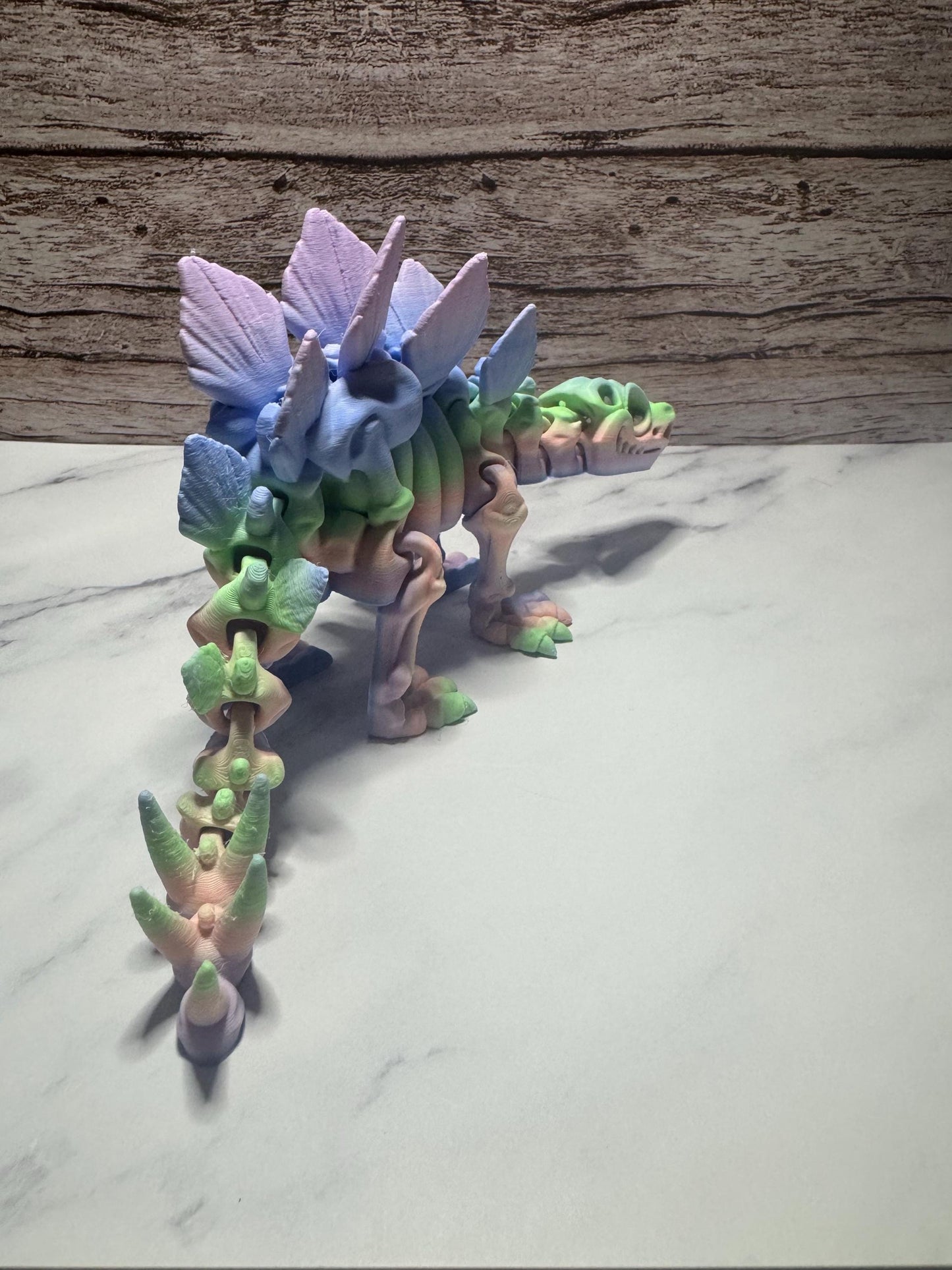 Articulated 3D Printed Stegosaurus Skeleton: Rainbow Flexi Dinosaur Toy for Prehistoric Enthusiasts