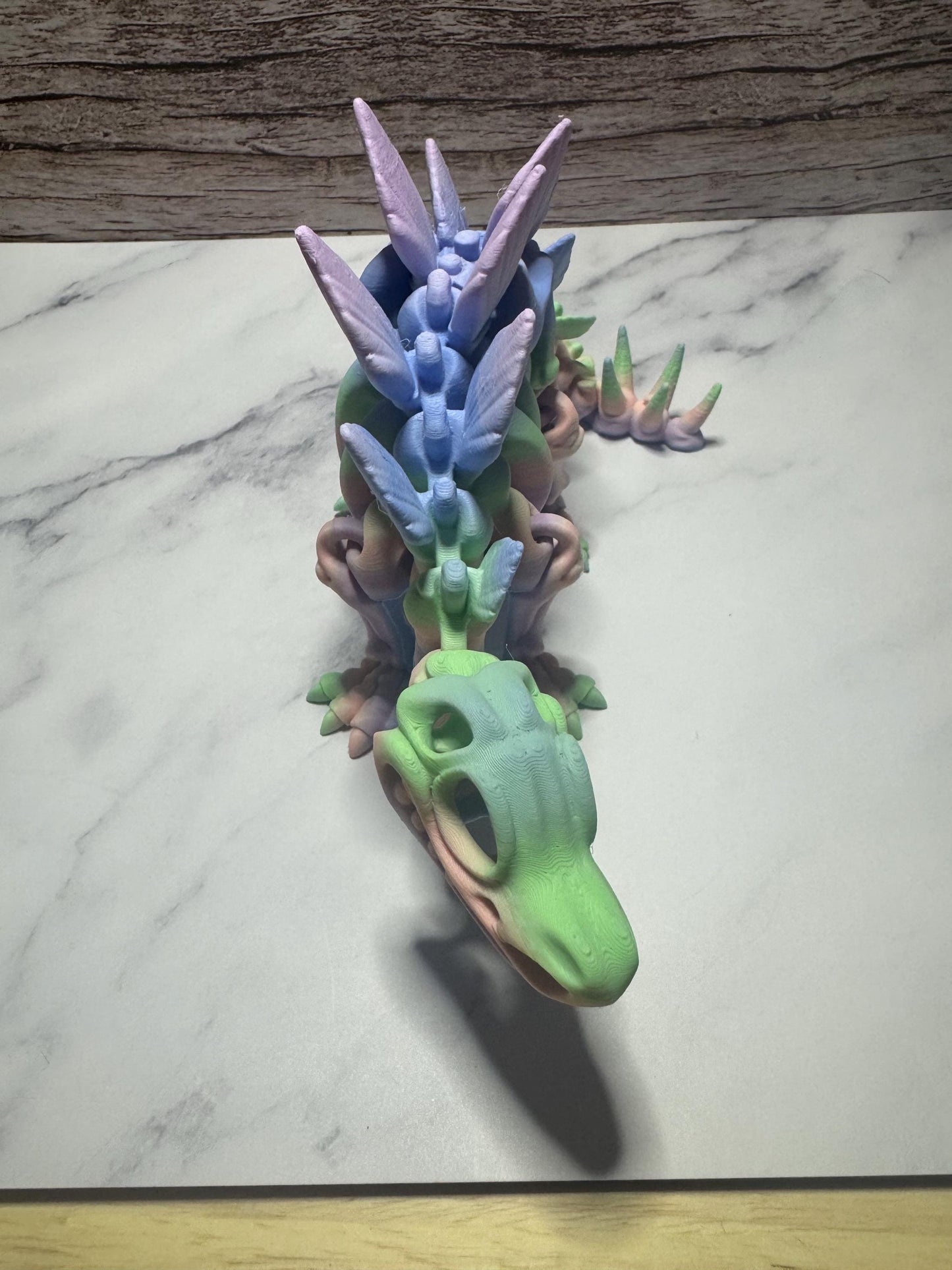 Articulated 3D Printed Stegosaurus Skeleton: Rainbow Flexi Dinosaur Toy for Prehistoric Enthusiasts