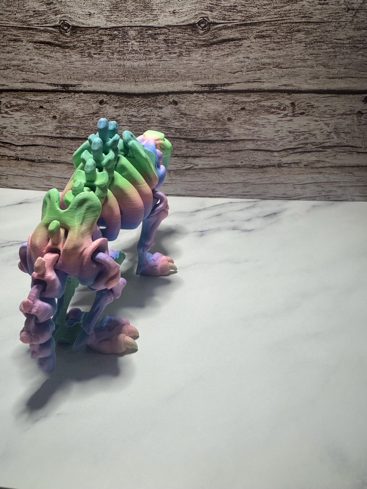 Articulated 3D Printed Saber-Toothed Tiger Skeleton: Rainbow Flexi Fidget Toy for Prehistoric Enthusiasts
